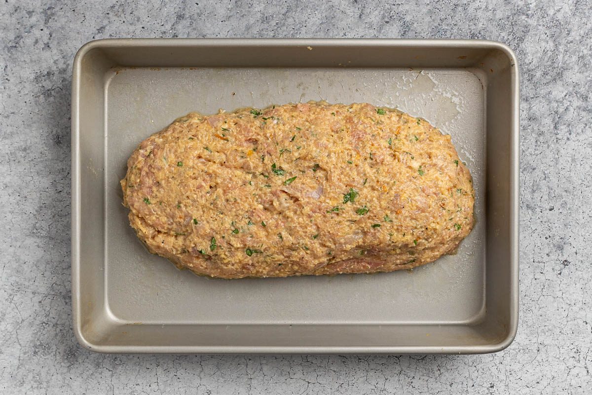 Taste of Home Chicken Loaf recipe photo of the chicken molded into a loaf on a baking sheet.