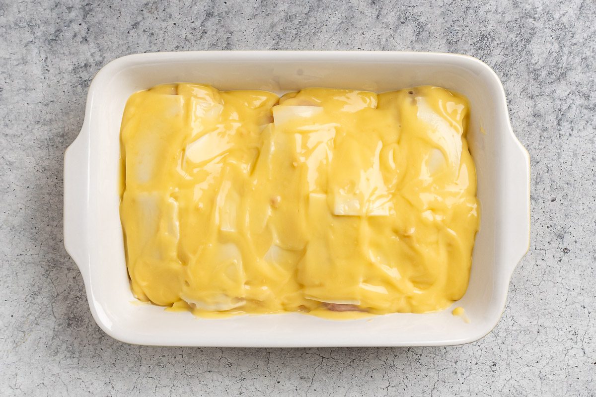 Taste of Home Chicken and Stuffing Casserole recipe photo of sauce poured of the chicken in a baking dish.