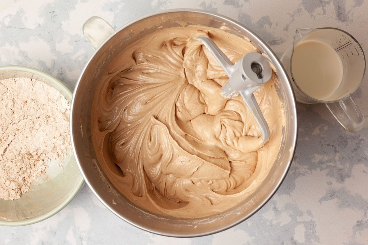 Step 1 of Taste of Home Chocolate Pound Cake is to cream the butter, shortening and sugar until light and fluffy, five to seven minutes. Add the eggs, one at a time, beating well after each addition. Combine the flour, baking powder and cocoa. Combine the milk and vanilla. Add the dry ingredients to the creamed mixture, alternating with the milk mixture. Mix everything well.