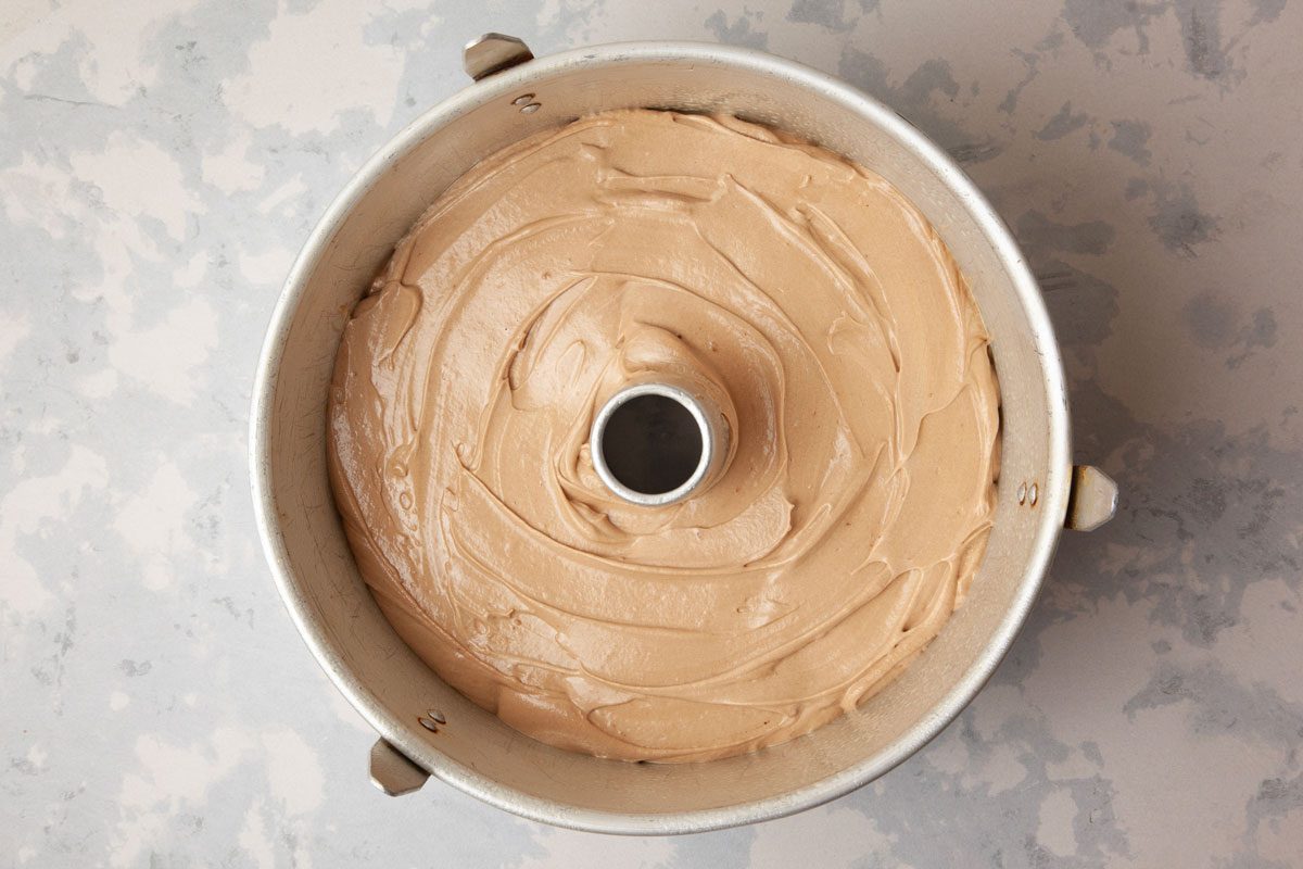Step 2 of Taste of Home Chocolate Pound Cake is to Pour the batter into a greased 10-inch tube pan. Bake the cake until a toothpick inserted in the center comes out clean, 70 to 80 minutes