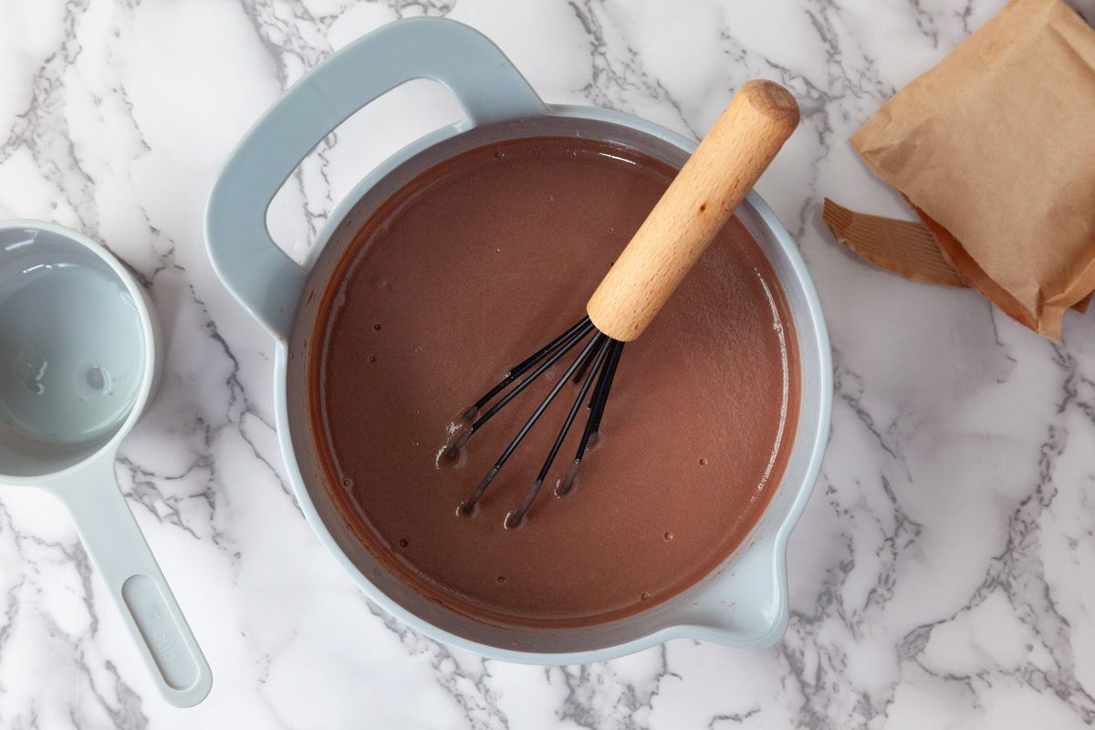 Step 2 of Taste of Home Crock-Pot Lava Cake is to whisk the milk and pudding mix for two minutes. Then let the pudding stand until it's soft-set, about two minutes.