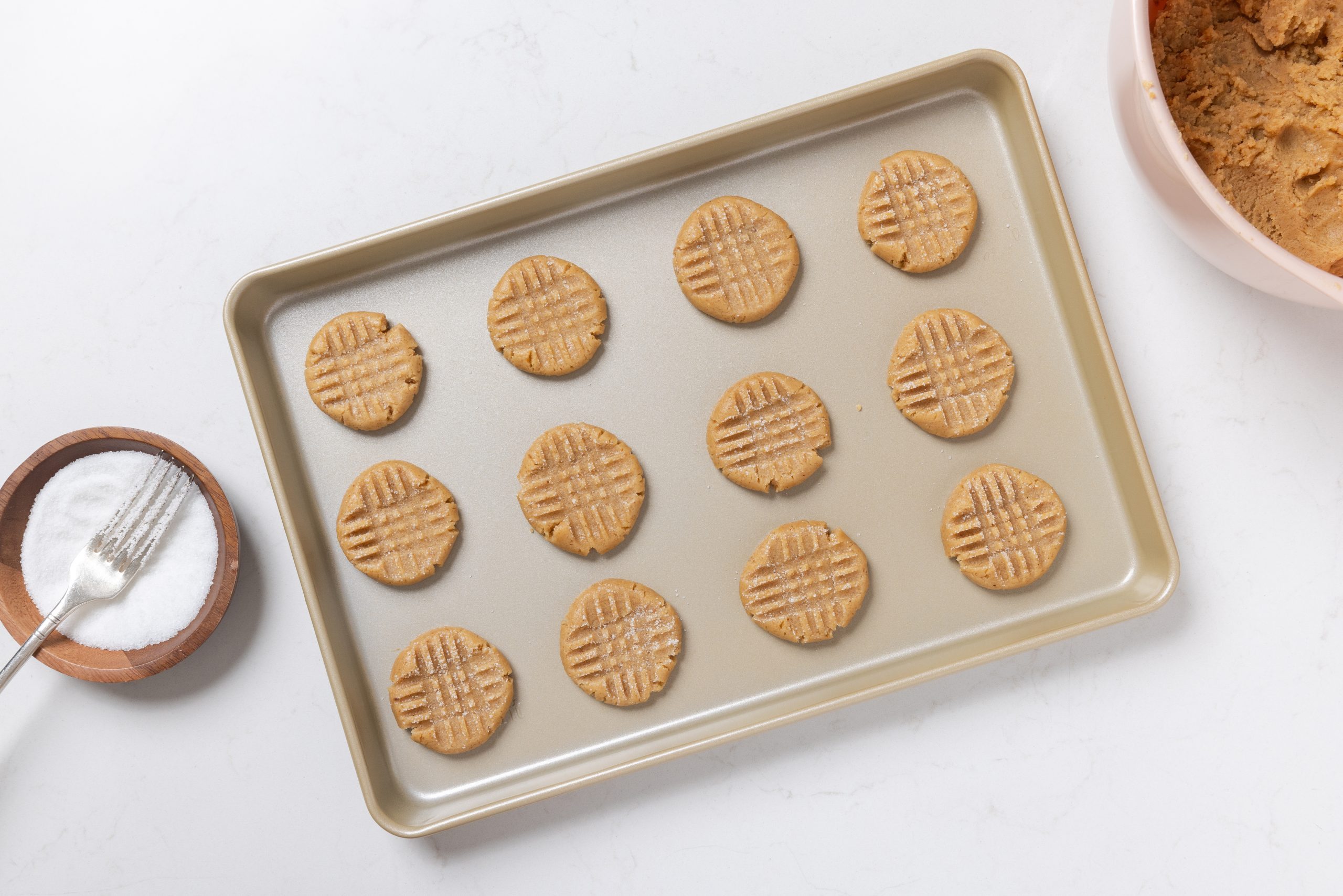 Cookies in baking tray ready to go in the oven.