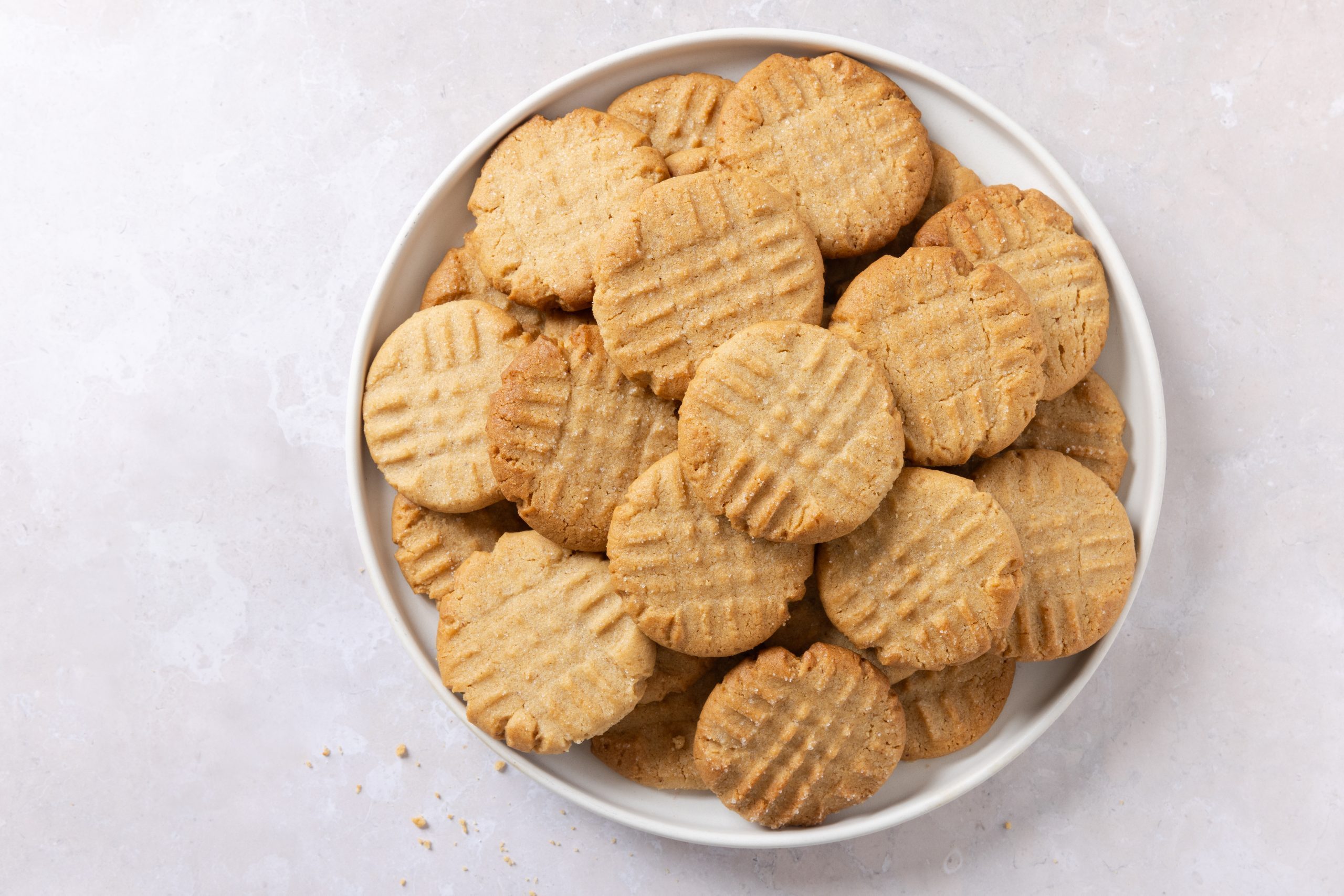 Cookies baked on white plate.