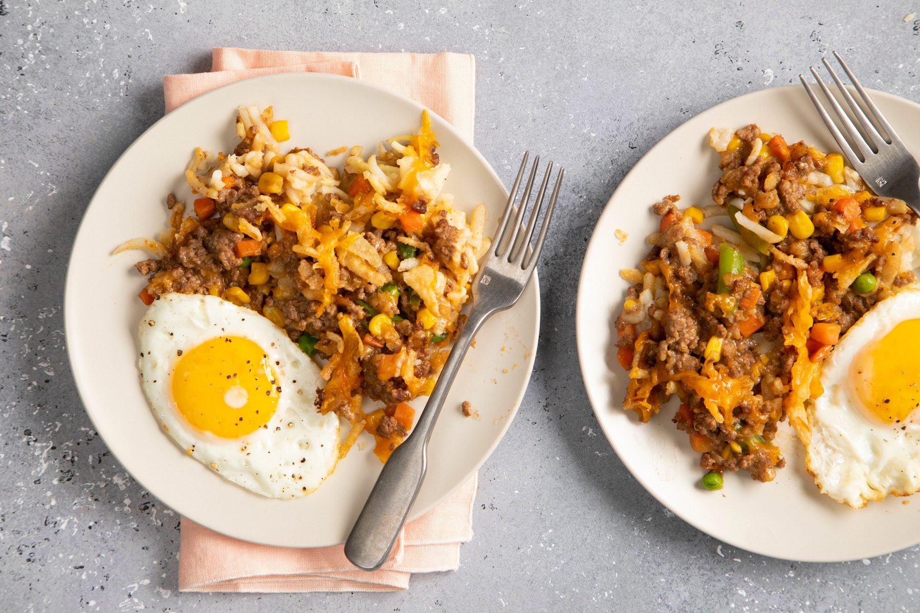 Hamburger Hash Brown served with sunny side up eggs top view shot