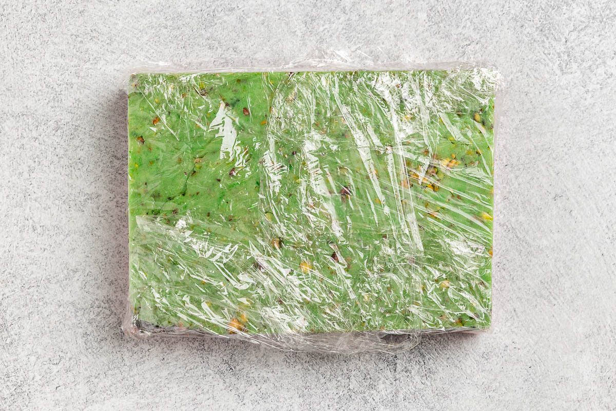 Taste of Home Italian Spumoni Cookies recipe photo of dough layered into a rectangles and wrapped for refrigeration.