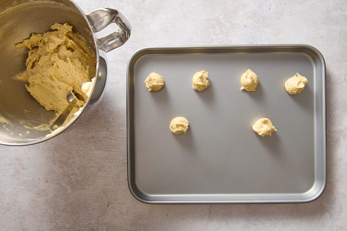Scooping dough out onto a baking sheet