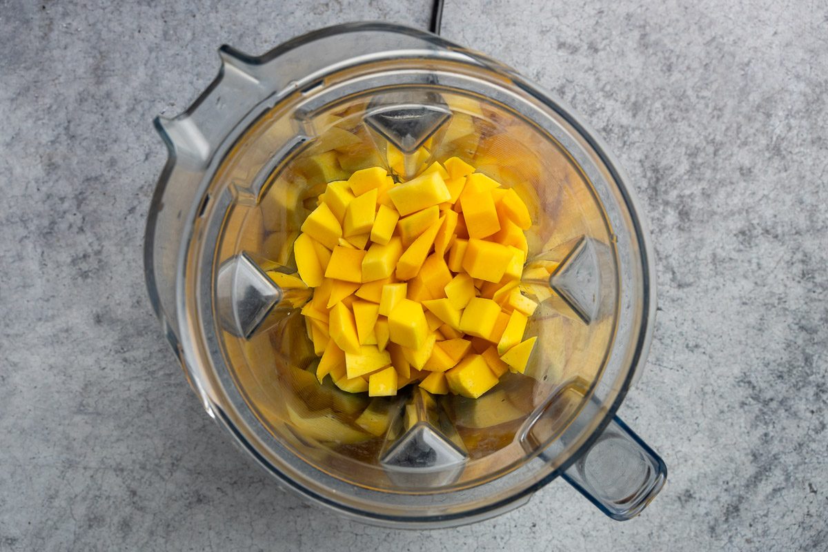 Taste of Home mango sorbet recipe photo of lemon juice and sugar added to the blender.