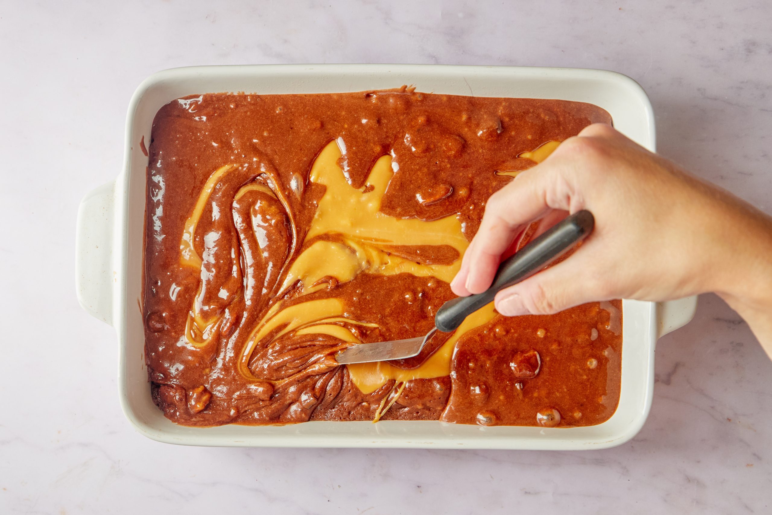 Add the caramel to the semi baked layer.