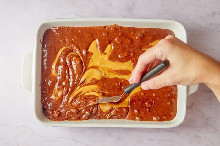 Add the caramel to the semi baked layer.
