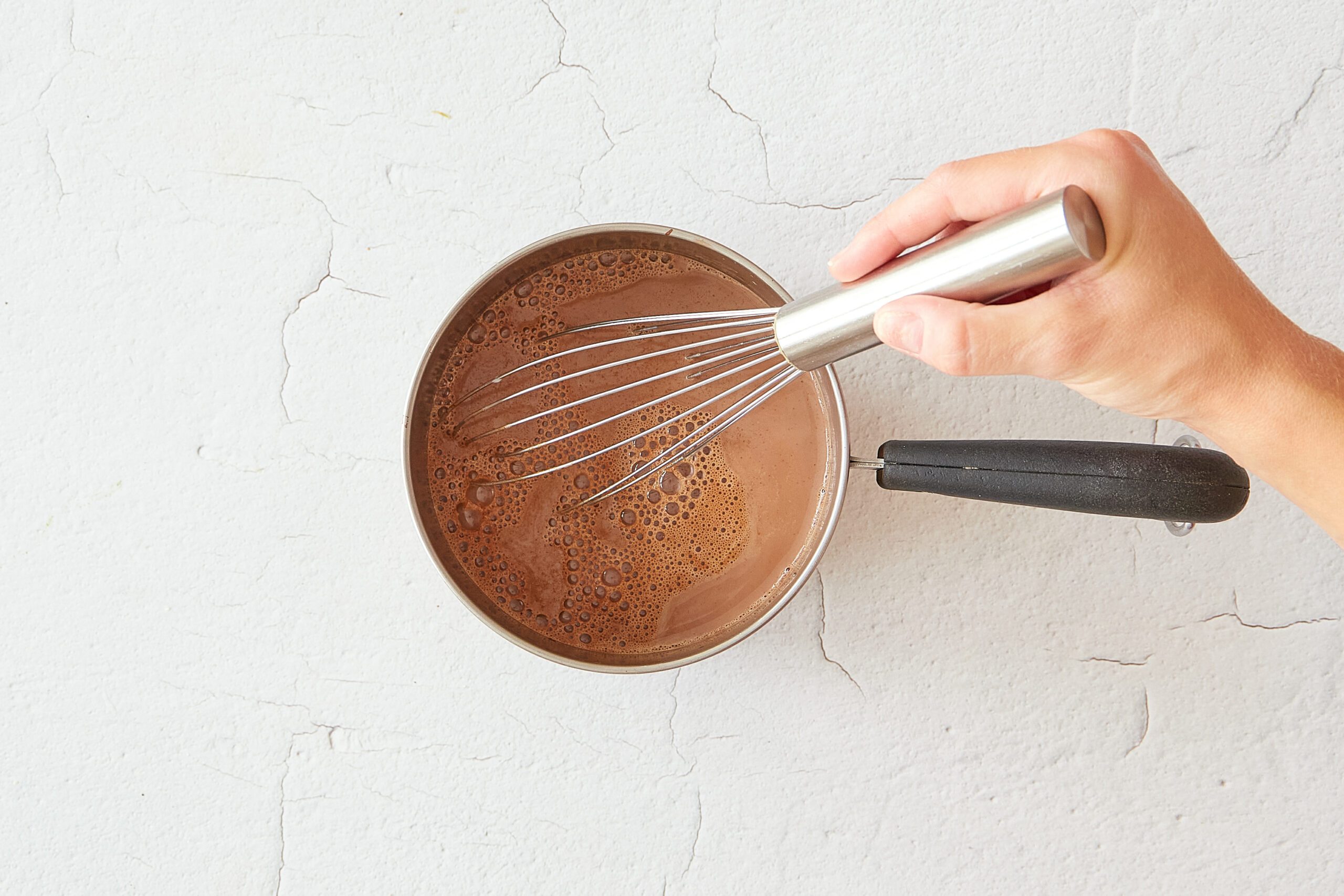 Whisk in the milk for Mexican hot chocolate.