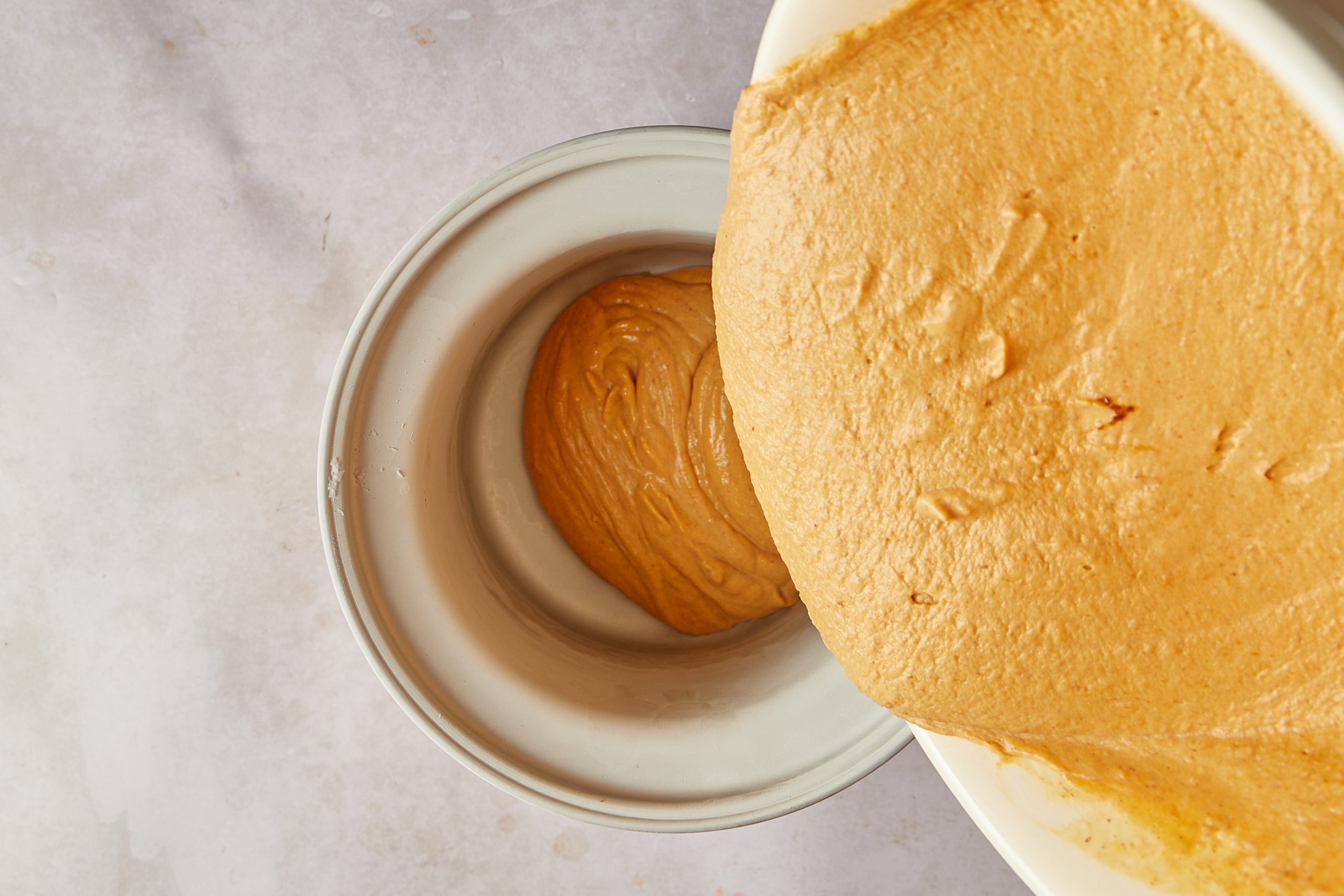 Fill the ice cream maker with pumpkin ice cream mixture.