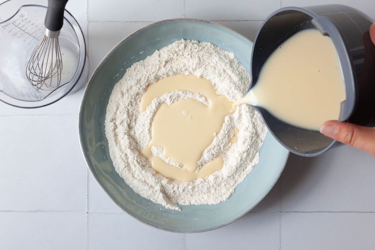 Step 1 of Taste of Home Pancakes and Sausage on a Stick is to combine the wet and dry ingredients separately and then add the dry to the wet, then let it sit for 15 minutes