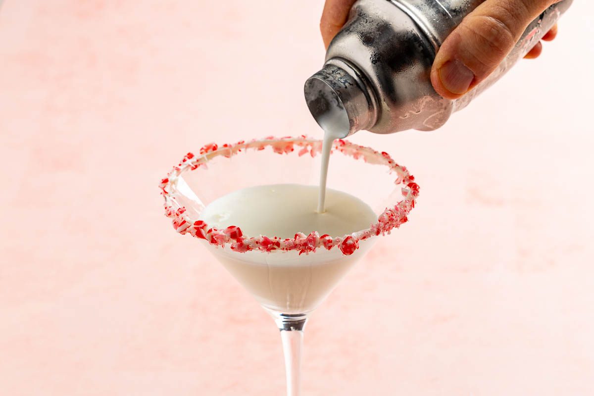 Taste of Home Peppermint Martini recipe photo of pouring the cocktail in a martini glass.