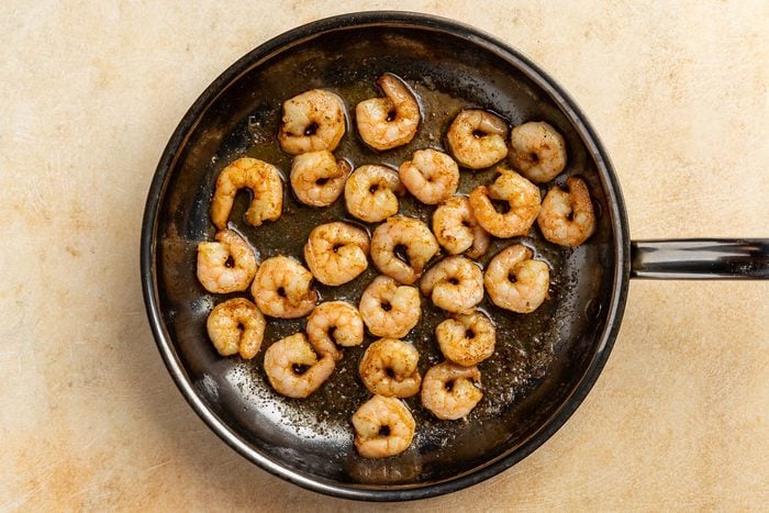 Taste of Home Shrimp Louie recipe photo of the shrimp sauteeed in a skillet.