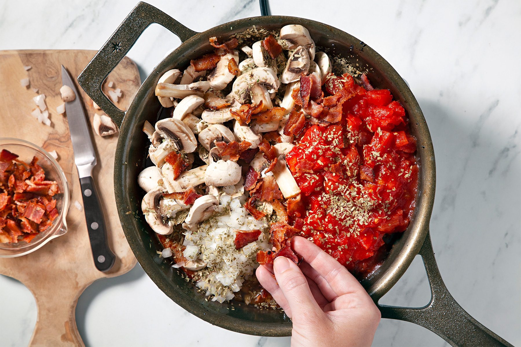 Top meat with mushrooms, tomatoes and onion; top view angle shot;
