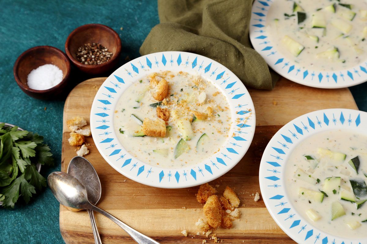 Taste of Home's Zucchini Soup served in bowls with croutons on top.