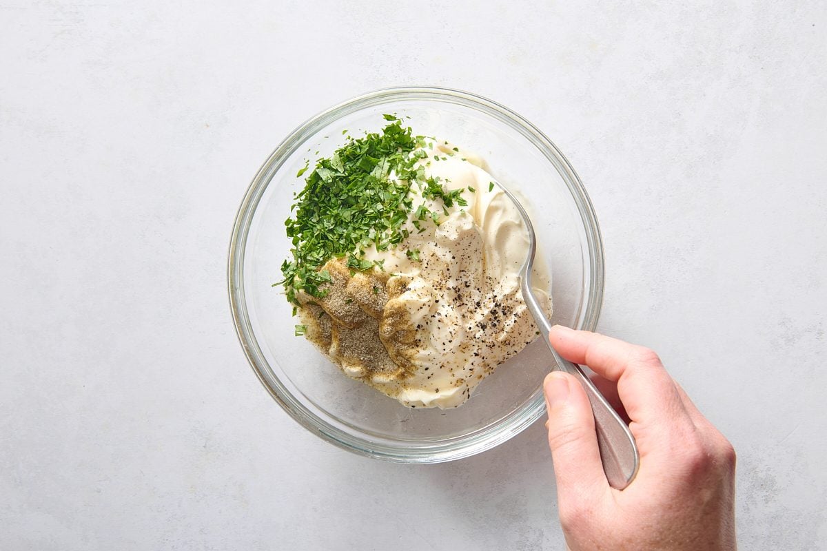 Staring dip ingredients together in a small bowl