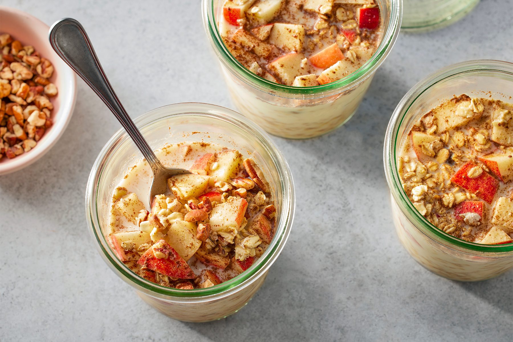 overhead shot of Apple Cinnamon Overnight Oats in a jars