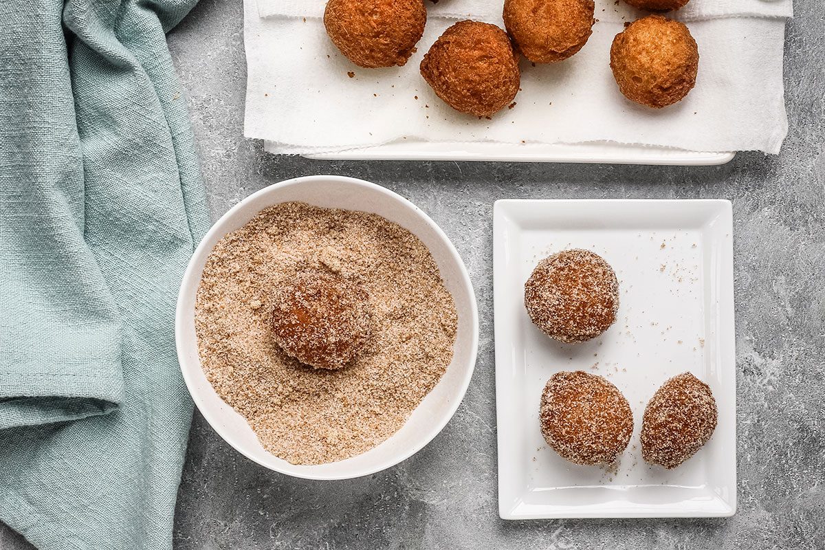 Banana beignets dipped in cinnamon sugar mixture.