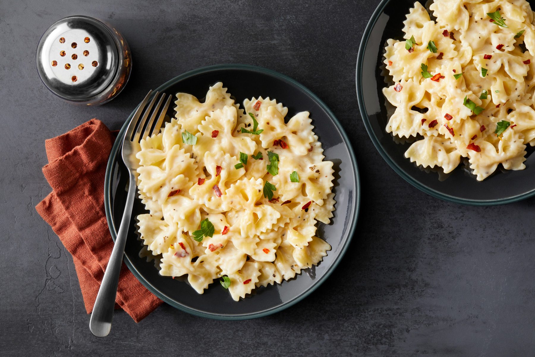 Overhead shot of Bow Tie Pasta in black bowls 