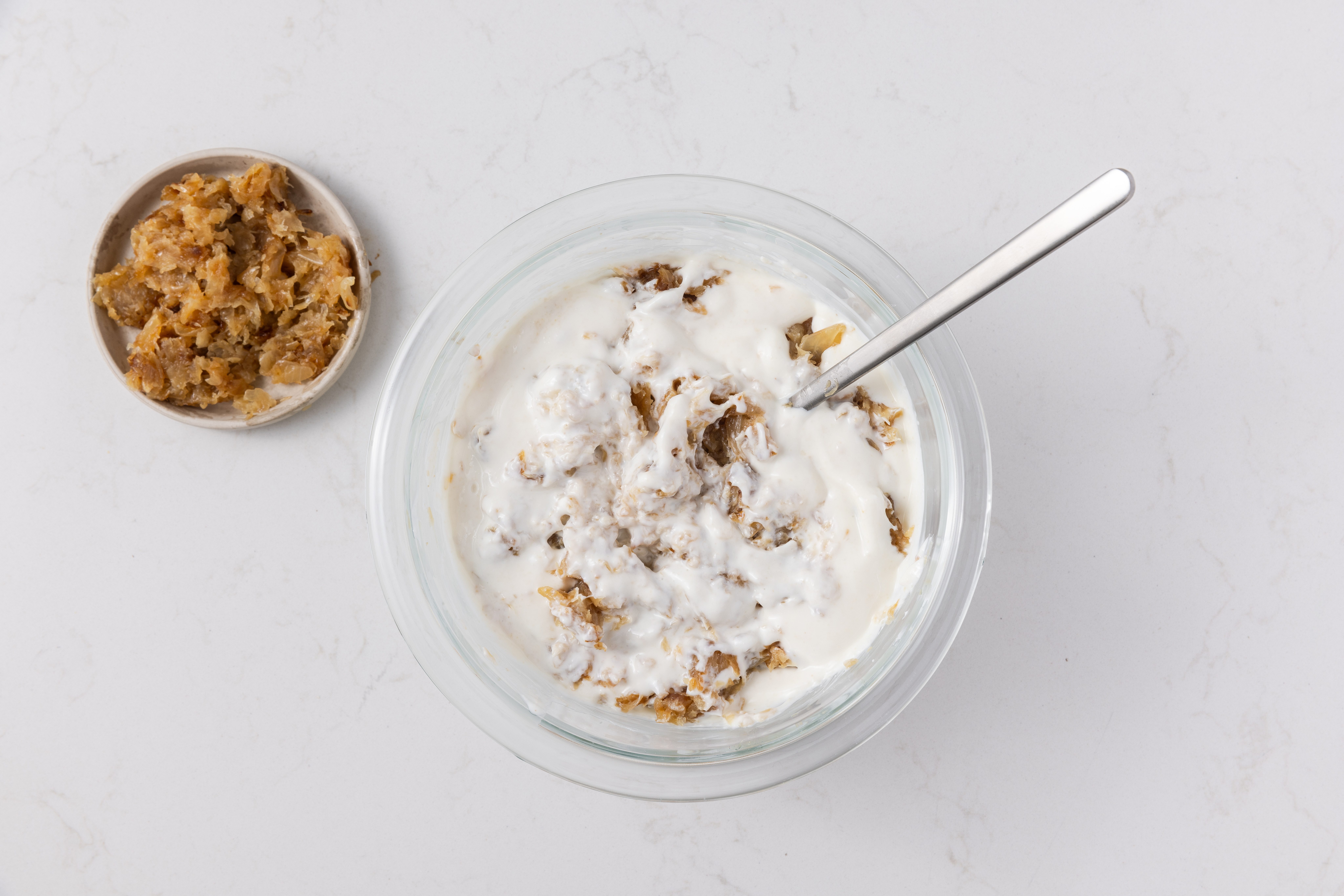 Onions and dip mixture combined in mixng bowl.