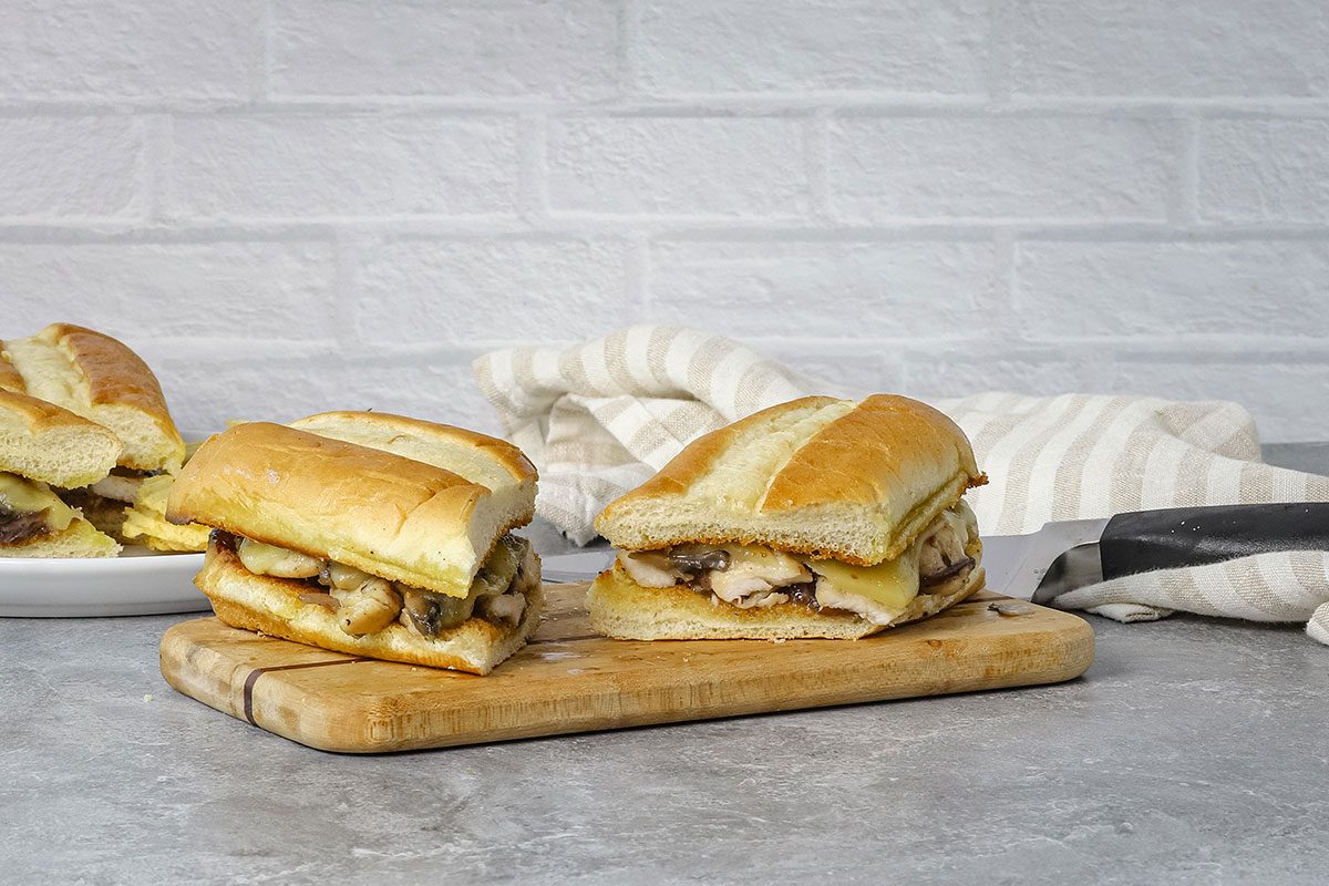 Cut chicken sub on a cutting board.