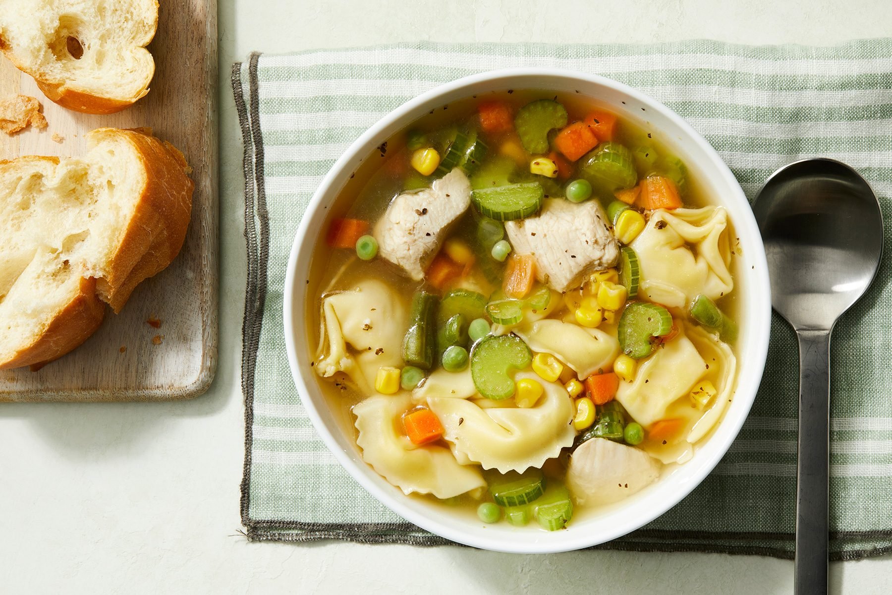 overhead shot of chicken tortellini soup in a bowl