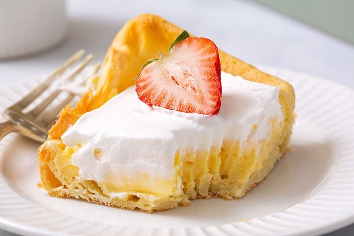 Slice Of Cream Puff Cake On Plate For Taste Of Home