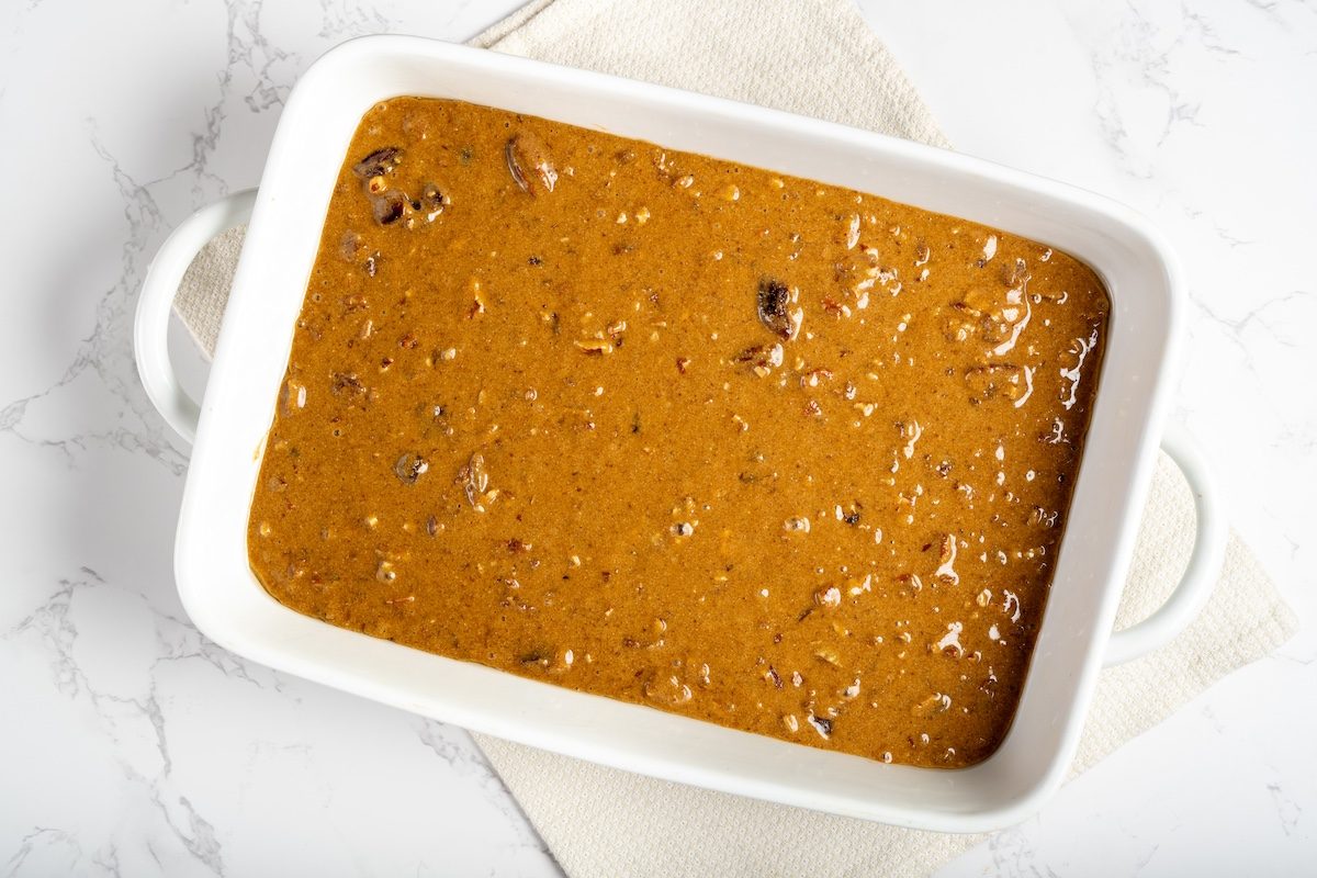 Overhead landscape shot of batter for Taste of Homes Date Nut Bars in a baking pan.