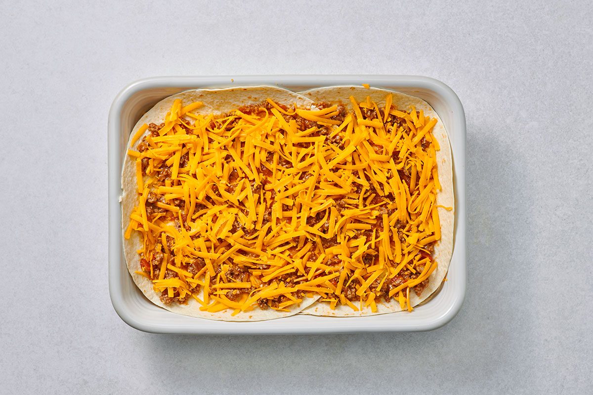 Enchilada casserole assembled before cooking