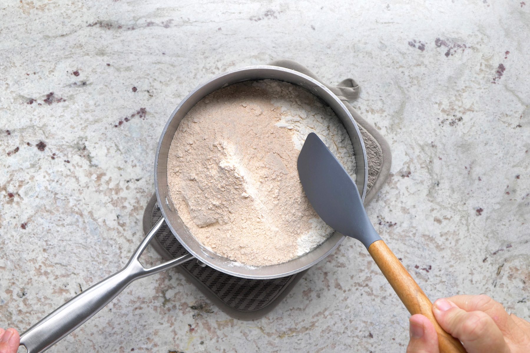 Stir in all-purpose flour and 1 cup whole wheat flour until smooth.