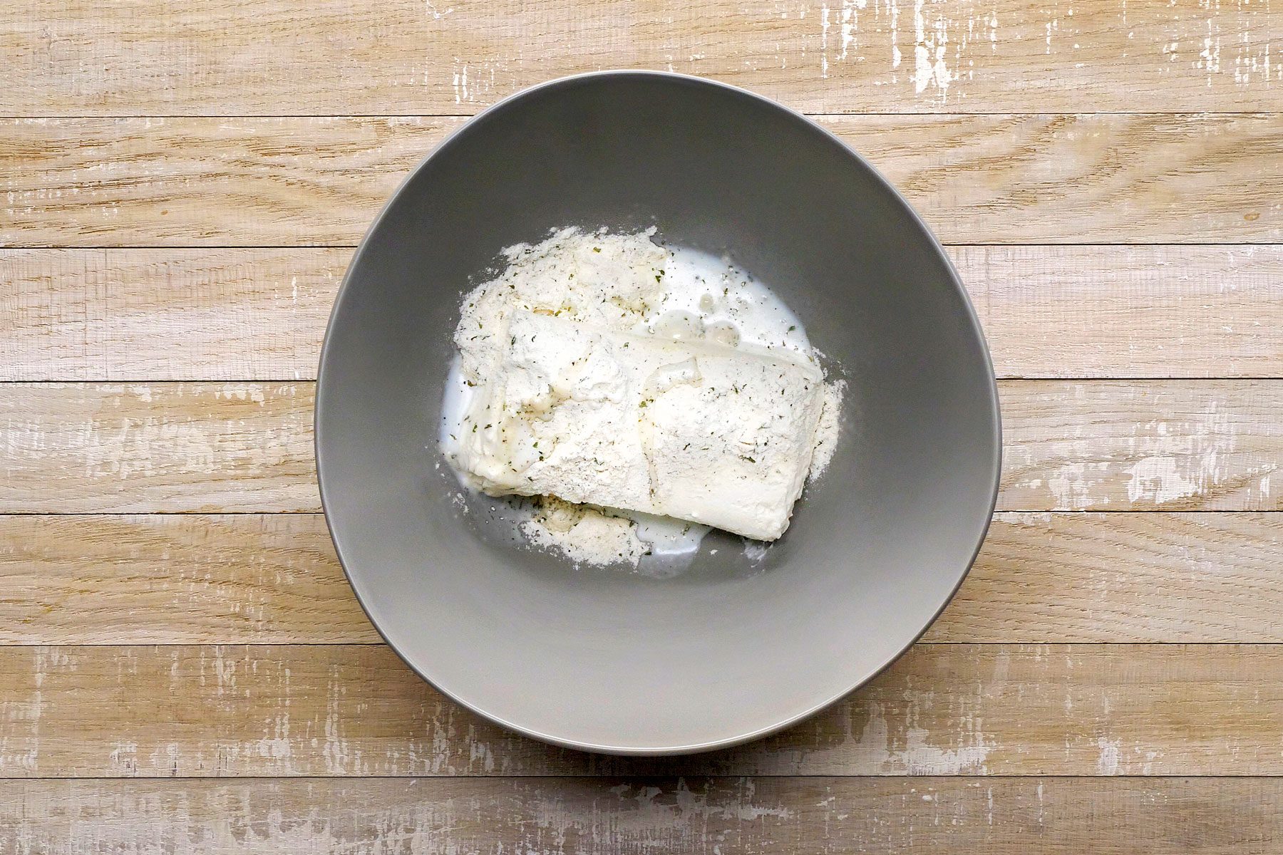 Cream cheese, ranch and milk mixed together in a large bowl.
