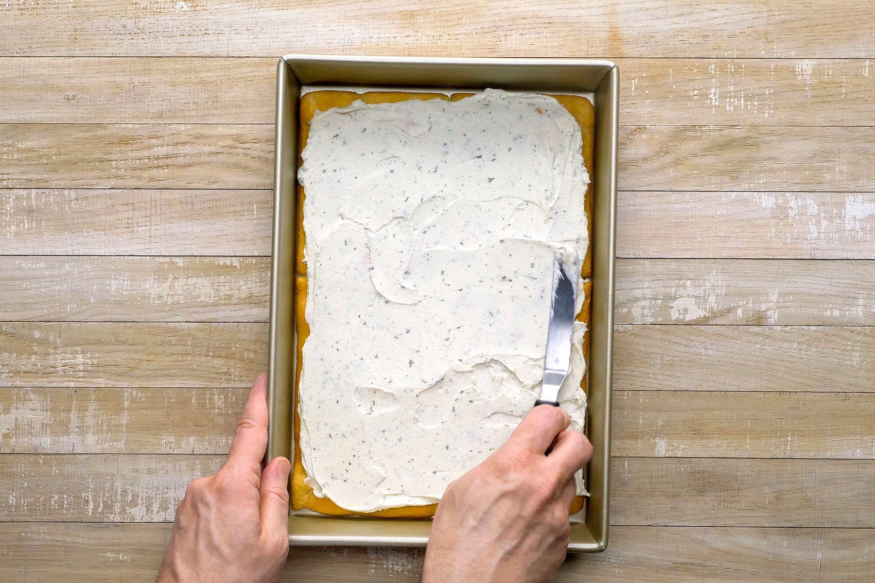 Cream cheese mixture spread over cooled crust.