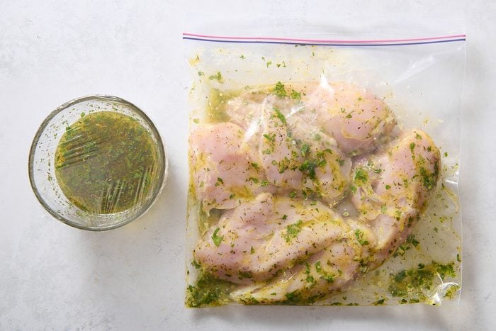 Chicken breasts marinating in a plastic bag