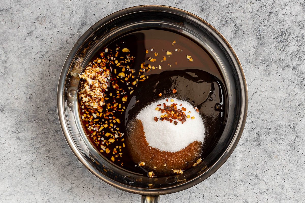 Taste of Home Hoisin Pork Tenderloin photo of combining the hoisin, soy sauce, sugar, garlic and red pepper flakes in a small unheated saucepan.