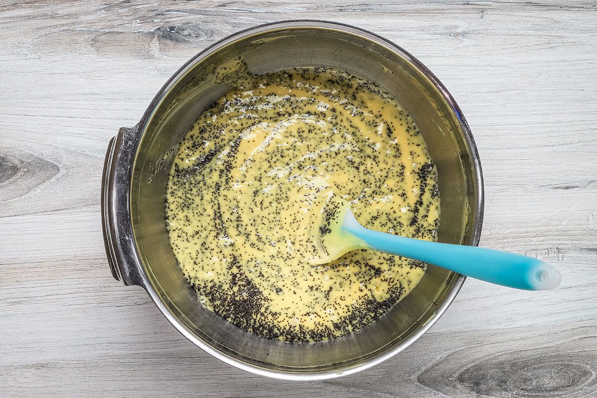 Folding the poppy seeds into the batter for Taste of Home Lemon Poppy Seed Cake.