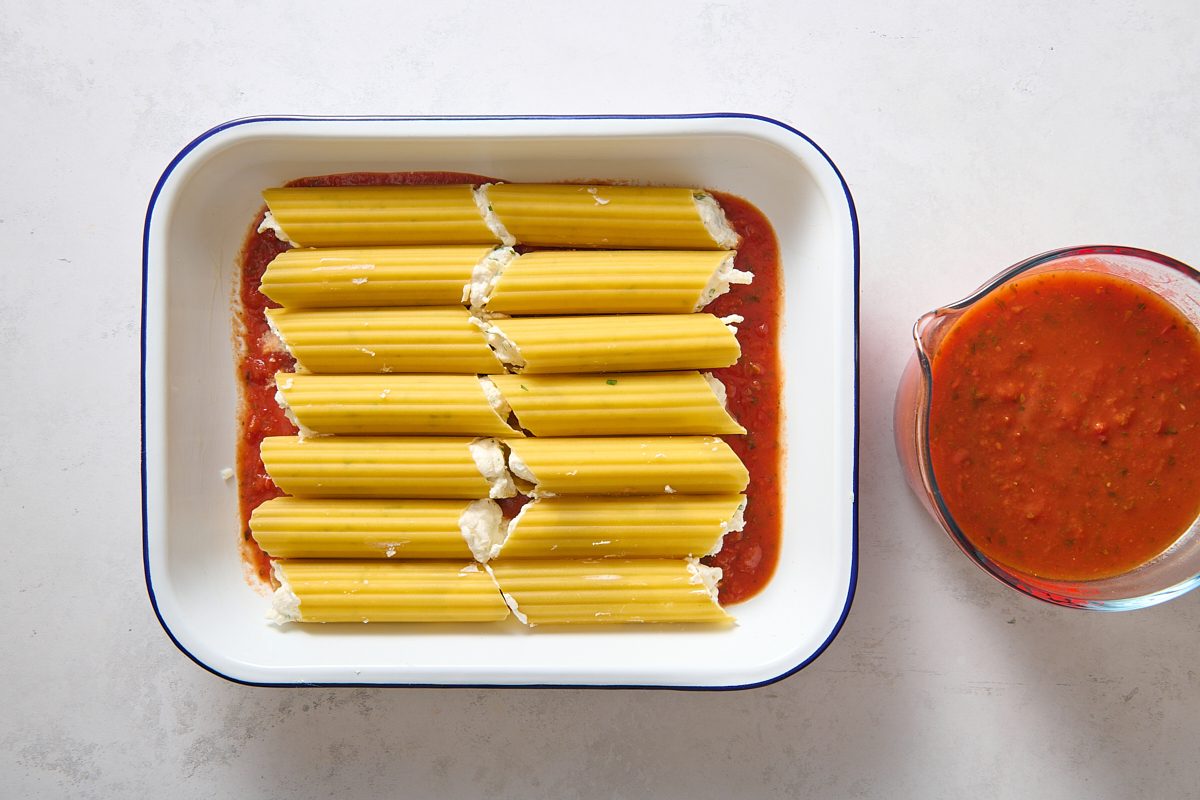 Assembling the filled manicotti shells 
