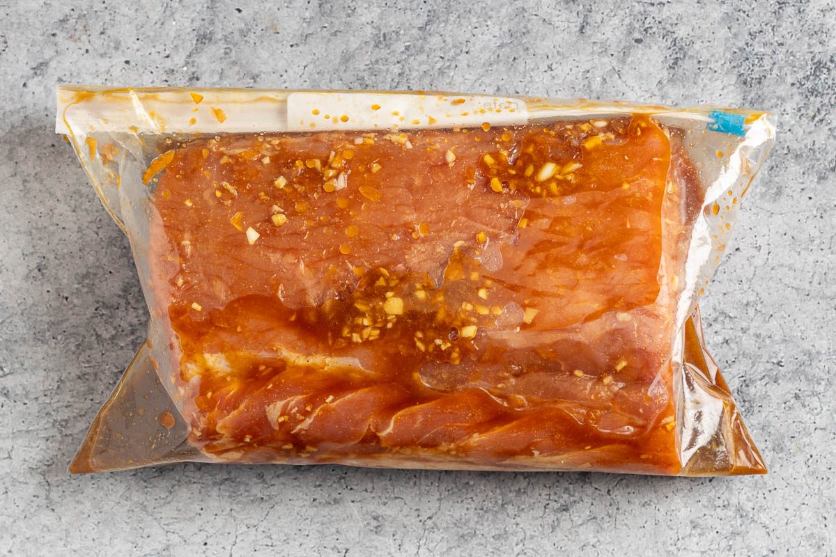 Taste of Home Marinated Pork Loin photo of the pork loin marinating in a resealable bag.