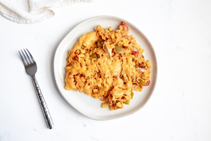Overhead beauty shot for Taste of Home Mexican Chicken and Rice with food served on a white plate.