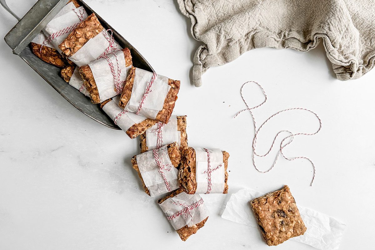 Taste of Home Nut Free Granola Bars in a large metal scoop on a marble surface