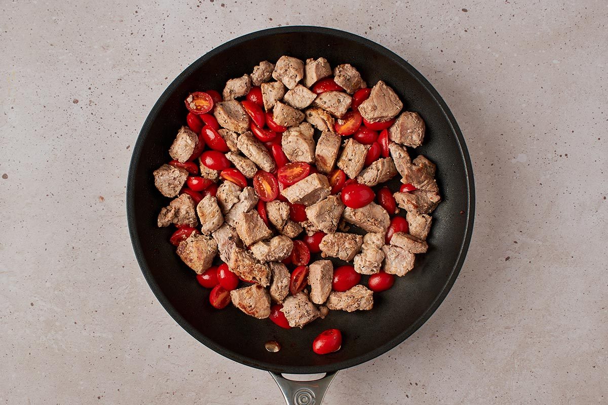 Add tomatoes to pork