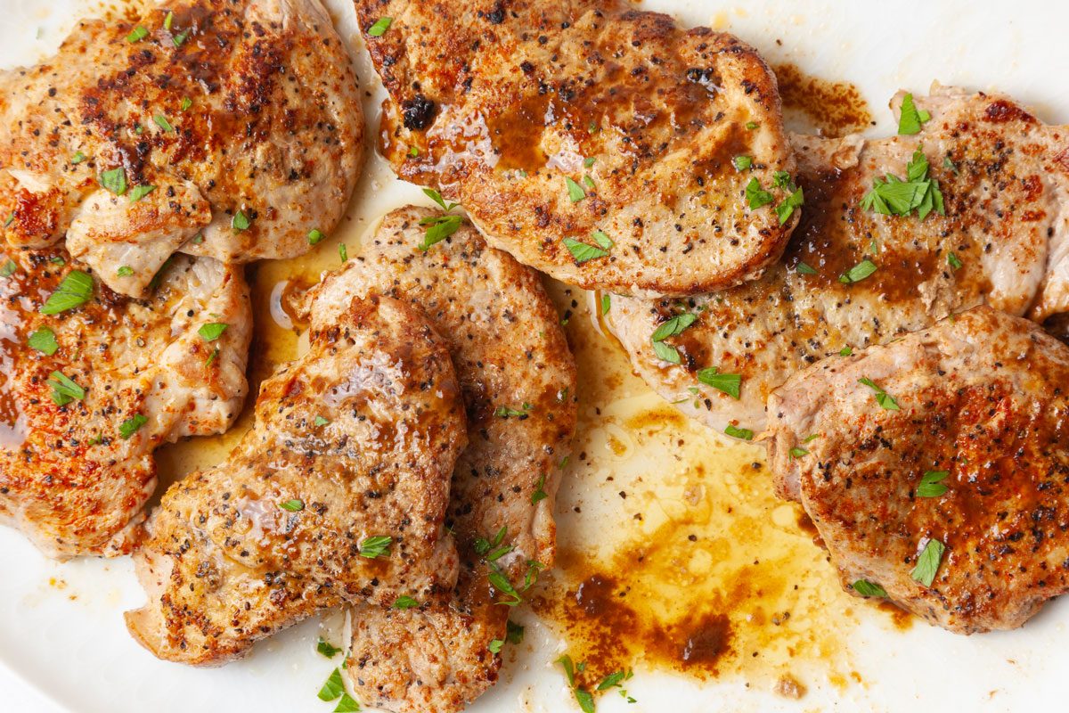 Full yield of Taste of Home Pork Diane with sauce, parlsey garnish, lemon pepper