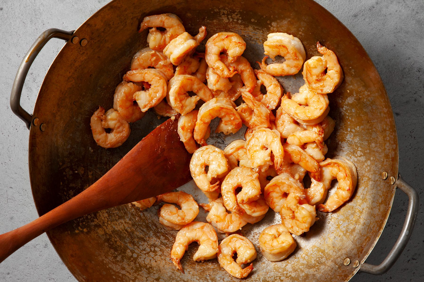 cook the shrimp until cooked through and pink, wok