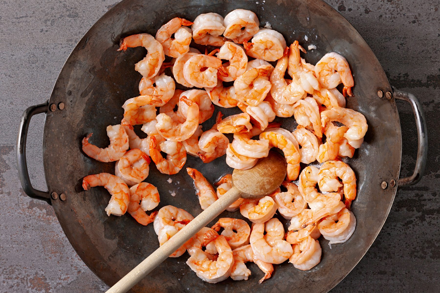 In a large wok, Cook shrimp until no longer pink