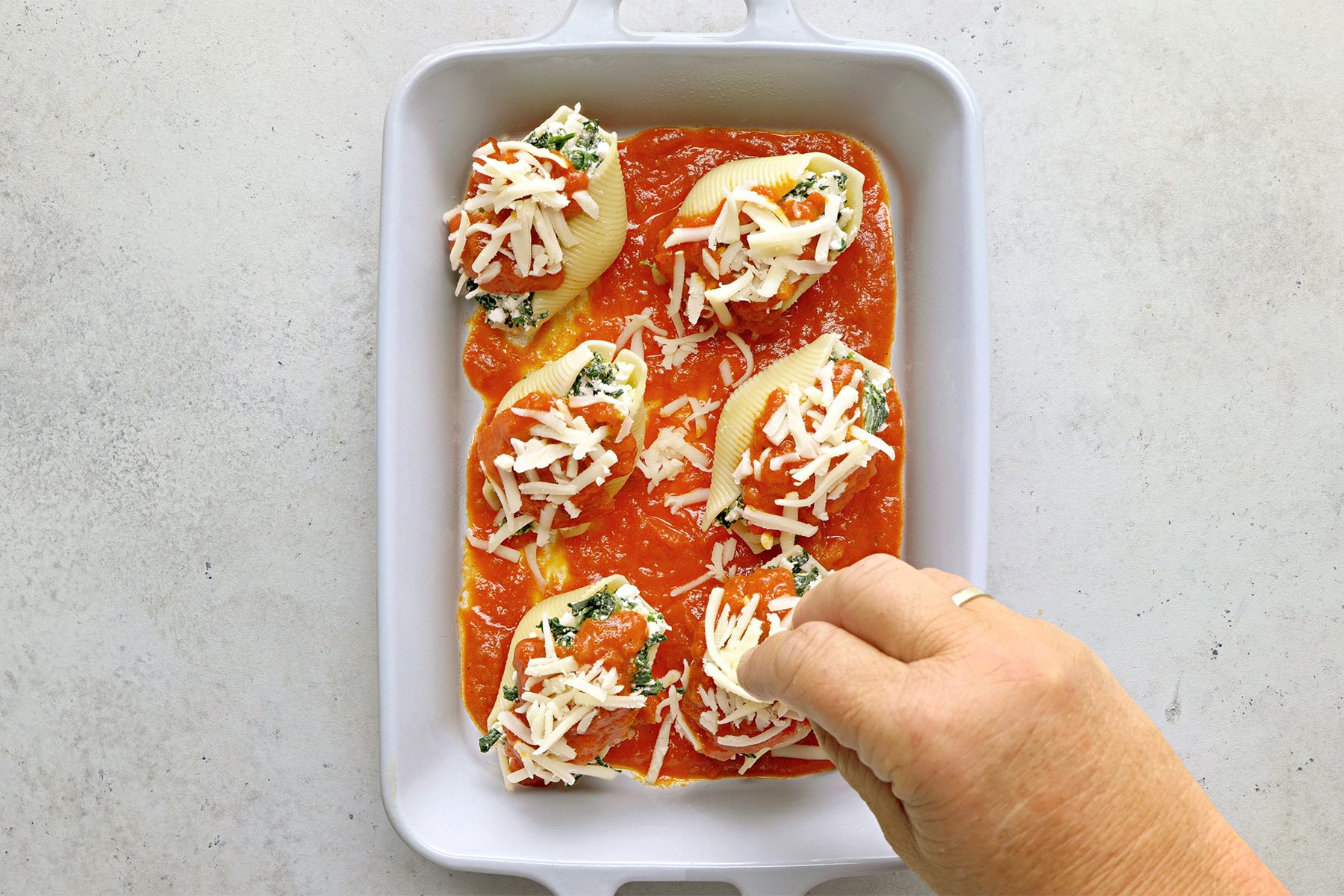 Arrange in prepared dish. Top with remaining spaghetti sauce and mozzarella.