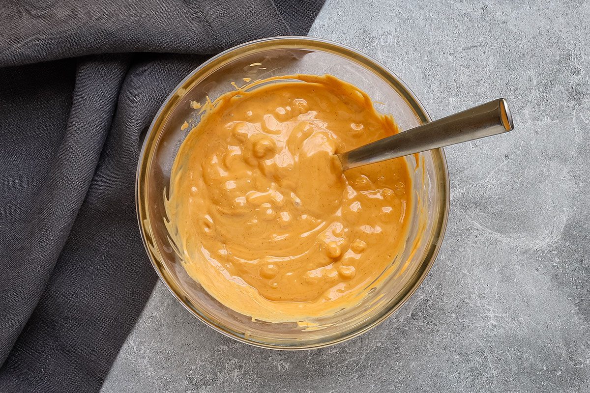 Melting the butterscotch chips and peanut butter for tumbleweed dessert.