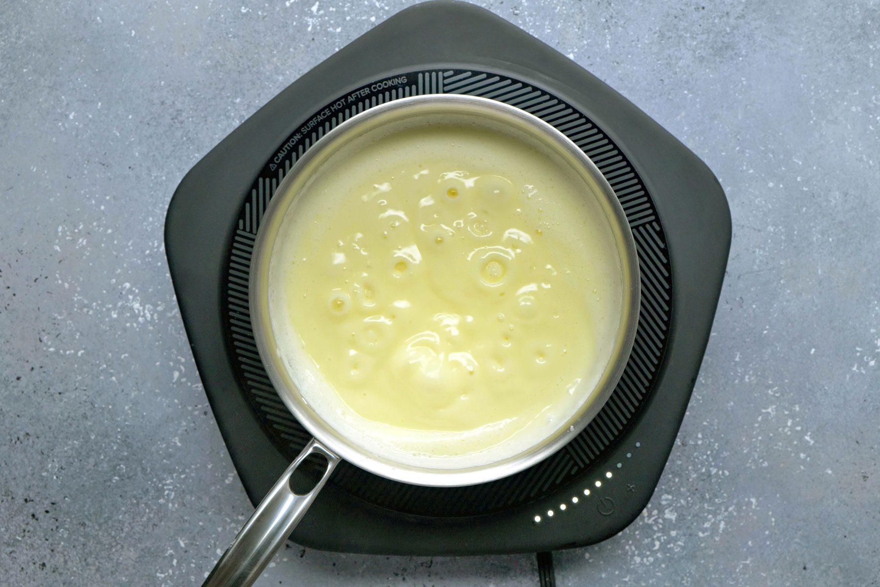 Milk, cornstarch and eggs mixture added to milk.