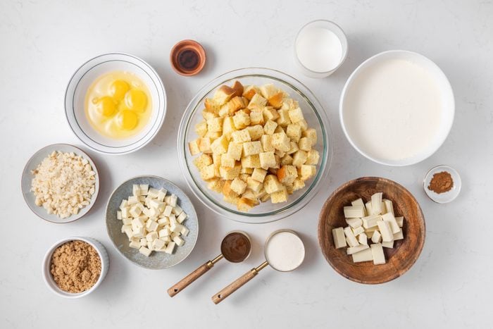 Ingredients for white chocolate bread pudding on kitchen counter.