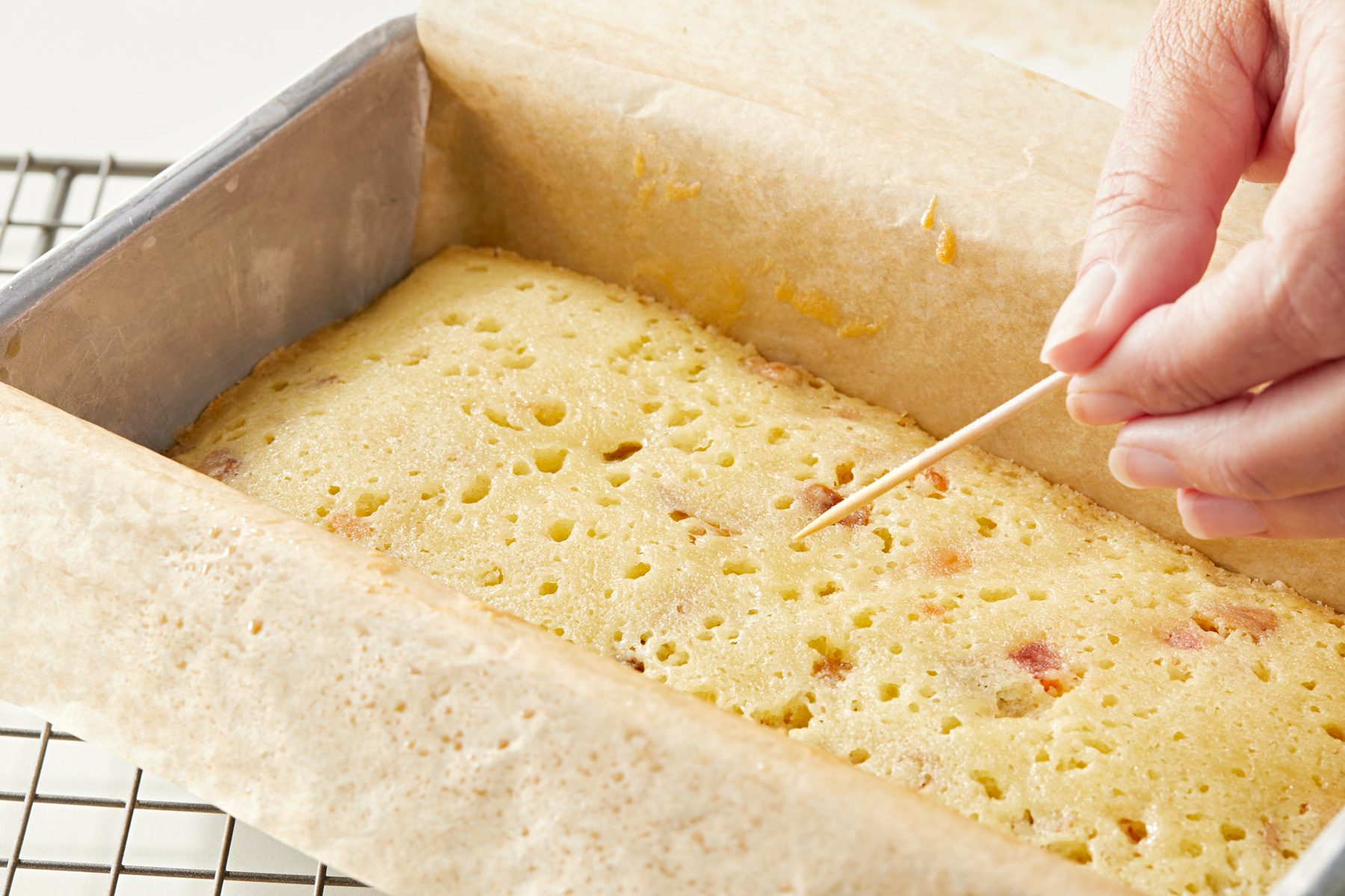 Checking for doneness with tooth pick