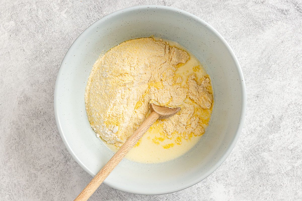 combining the wet and dry ingredients.